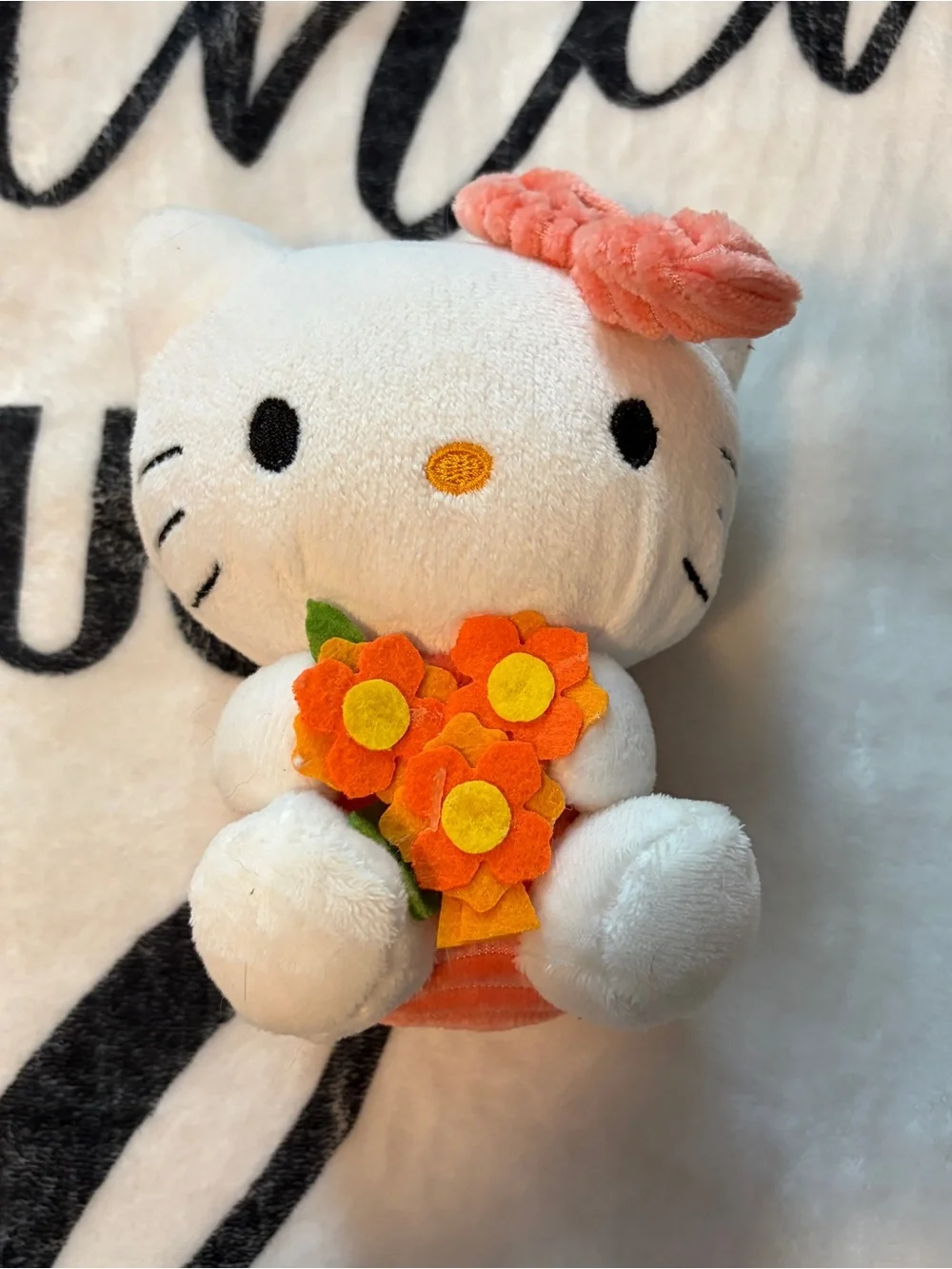 Sanrio White Plush Kitty with Orange Floral Bouquet
